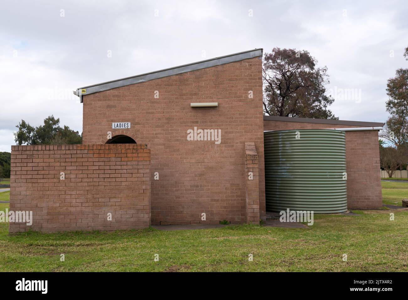 A brick and steel roof, public toilet beside the Hawthorn Canal in Haberfield, New South Wales, Australia Stock Photo
