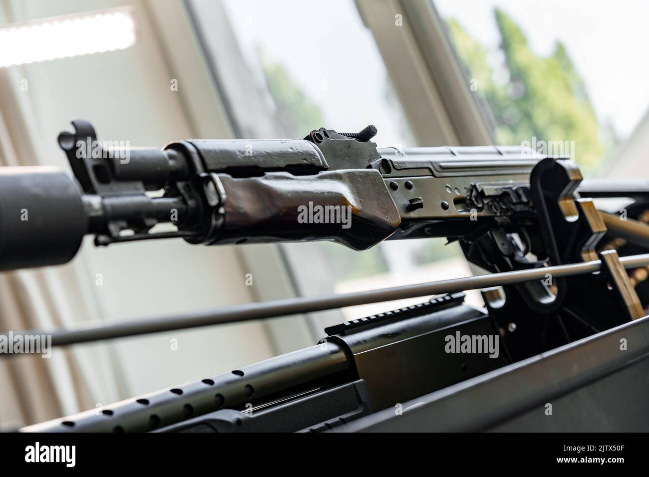 Automatic rifle on stand on the table of the weapons Stock