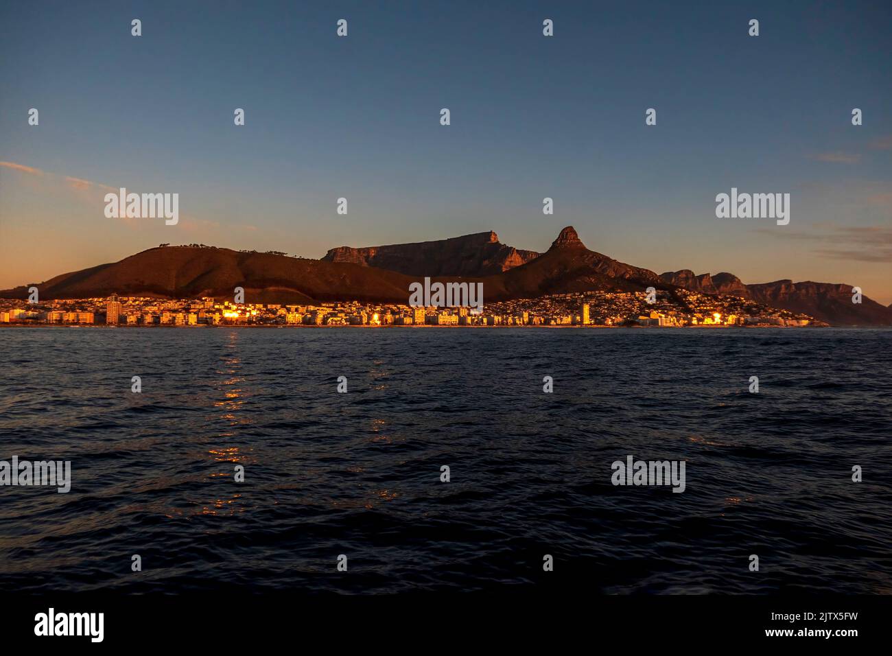 View of the table mountain in Cape Town at sunset from the sea. South Africa Stock Photo