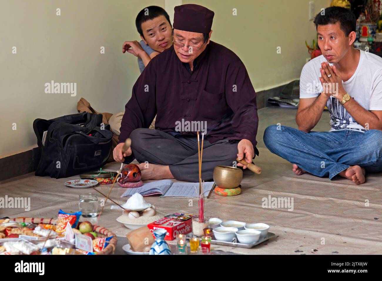 Buddhist offering and incense in Vietnamese house, Hai Phong, Vietnam Stock Photo
