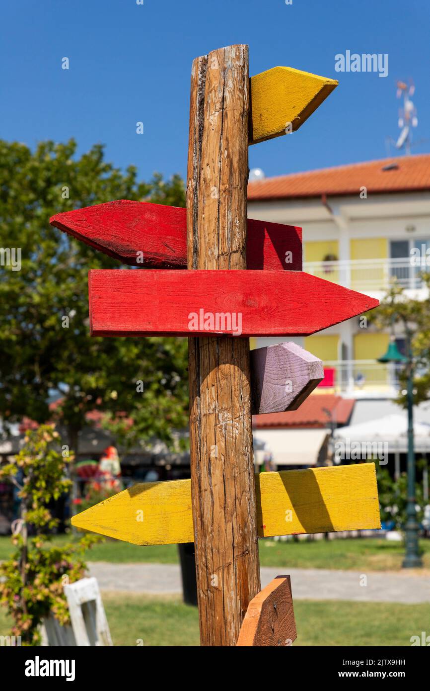 Wooden arrow sign post. Empty boards for your text. Copy space. Stock Photo