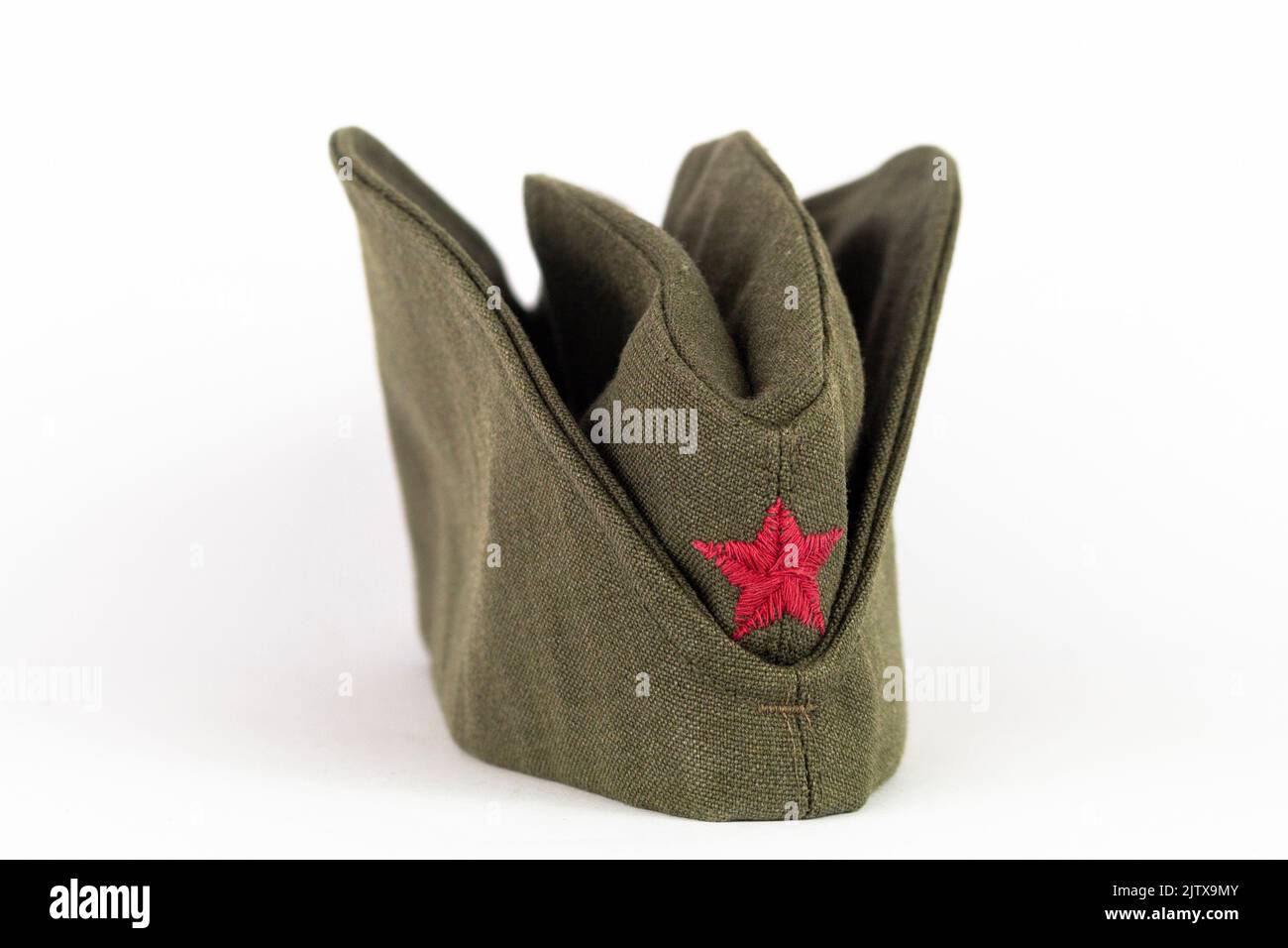 Military cap. Yugoslavian army side cap with red star from the time of communism and world war era. Stock Photo