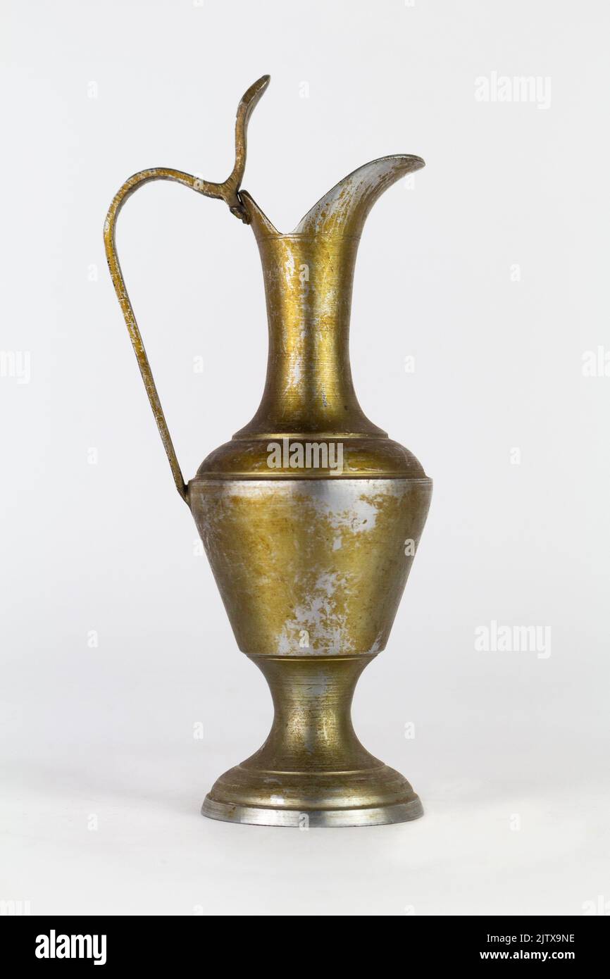 Antique oxidized jug isolated on a white background. Stock Photo