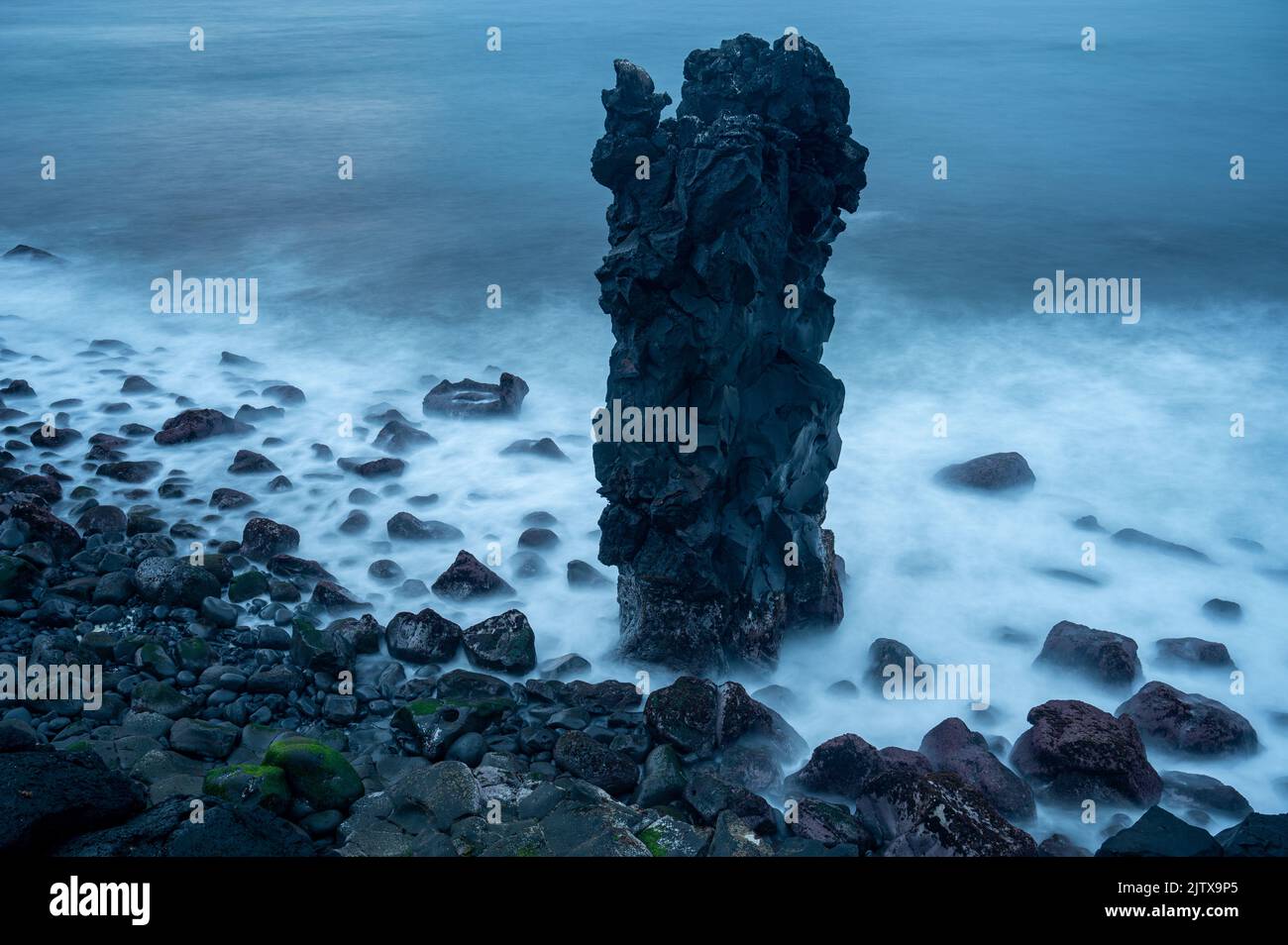 Black volcanic rock in the Atlantic ocean Stock Photo
