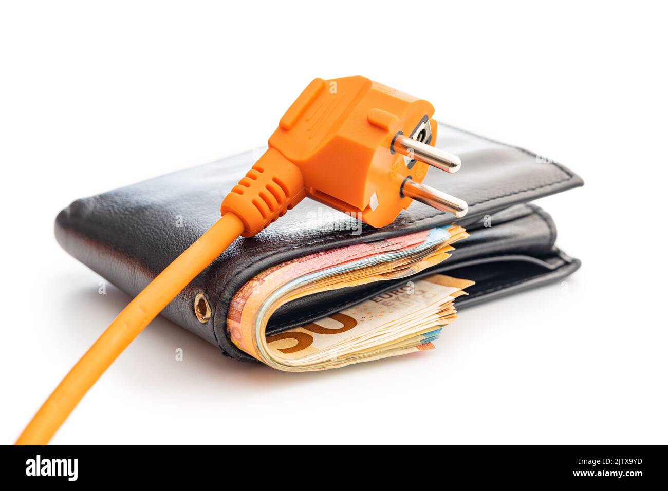 Orange electric plug and wallet with money isolated on the white background. Concept of increasing electricity prices. Stock Photo
