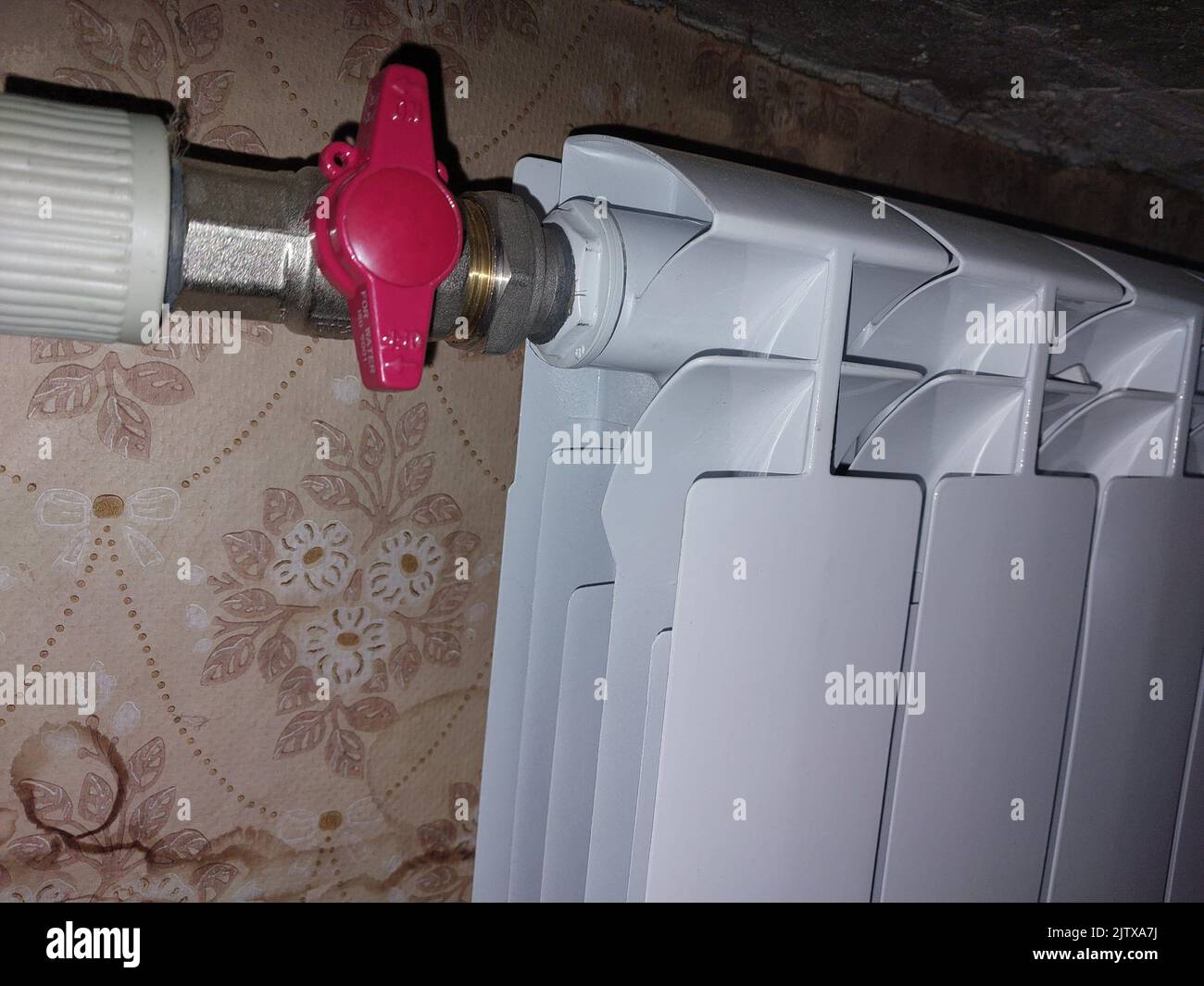 Installed metal heating radiators in the living room in a the apartment