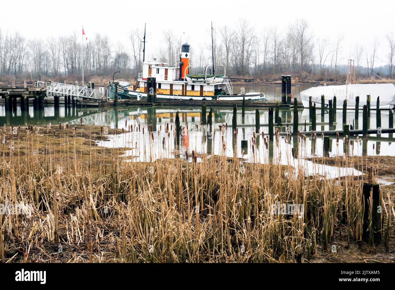 A boat on the Fraser River at Steveston, Richmond, BC, Canada. Stock Photo