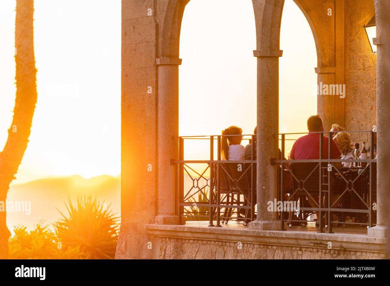 people enjoying the sunset in the restaurant, sanctuary of Cura, Puig de Cura, Algaida, Majorca, Balearic Islands, Spain. Stock Photo