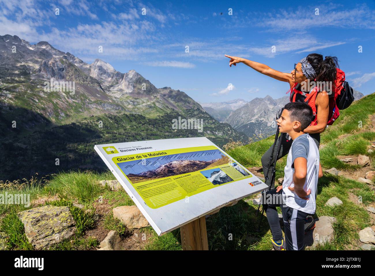 looking at the mountain from the poster interpretation, Benasque Valley, Huesca, Pyrenean mountain range, Spain. Stock Photo