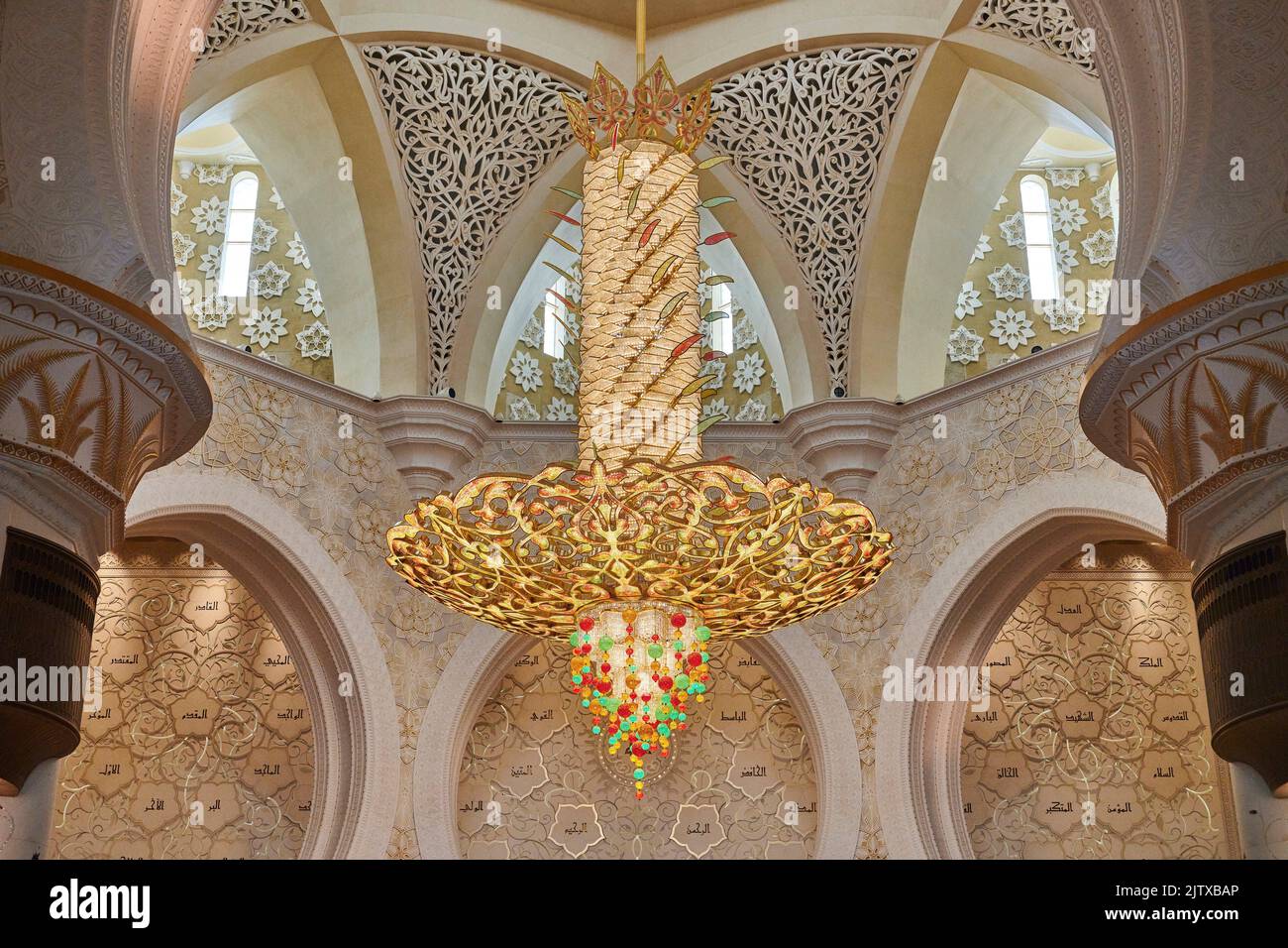 A large decorated chandelier haning in the prayer room at Sheikh Zayed Mosque. Abu Dhabi. United Arab Emirates. Stock Photo