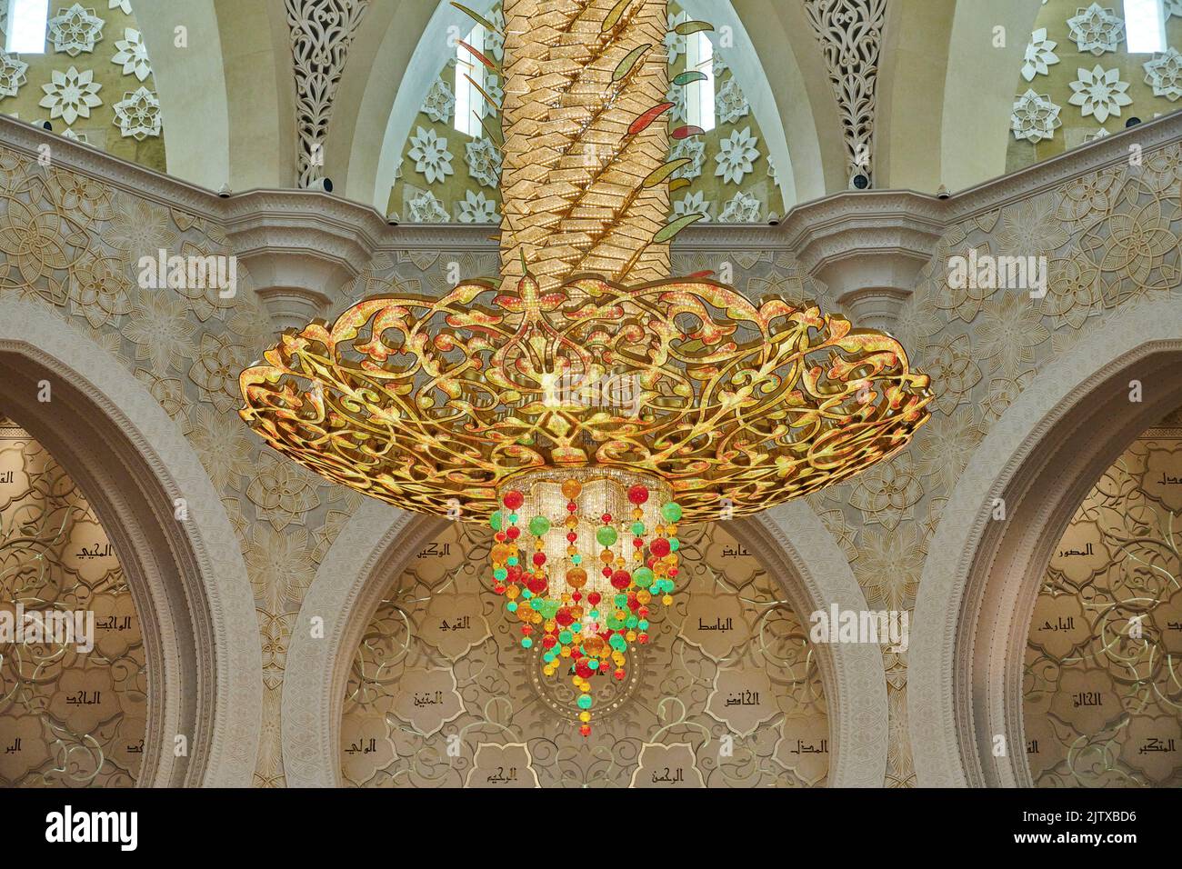 A large decorated chandelier hanging in the prayer room at Sheikh Zayed Mosque. Abu Dhabi. United Arab Emirates. Stock Photo