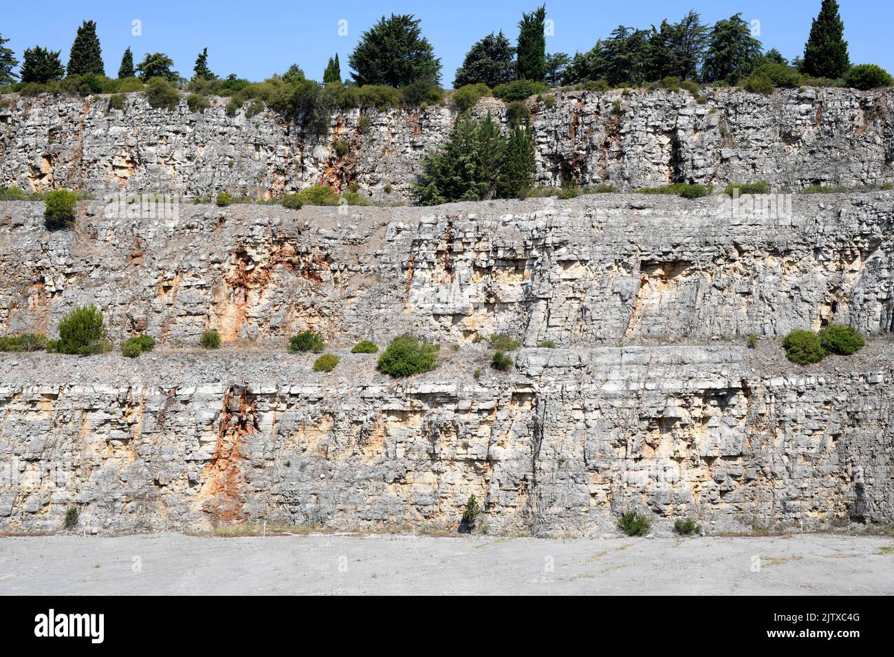 Stratified limestone in old quarry of Pedreira do Galinha, Serra de Aire, Portugal. Stock Photo