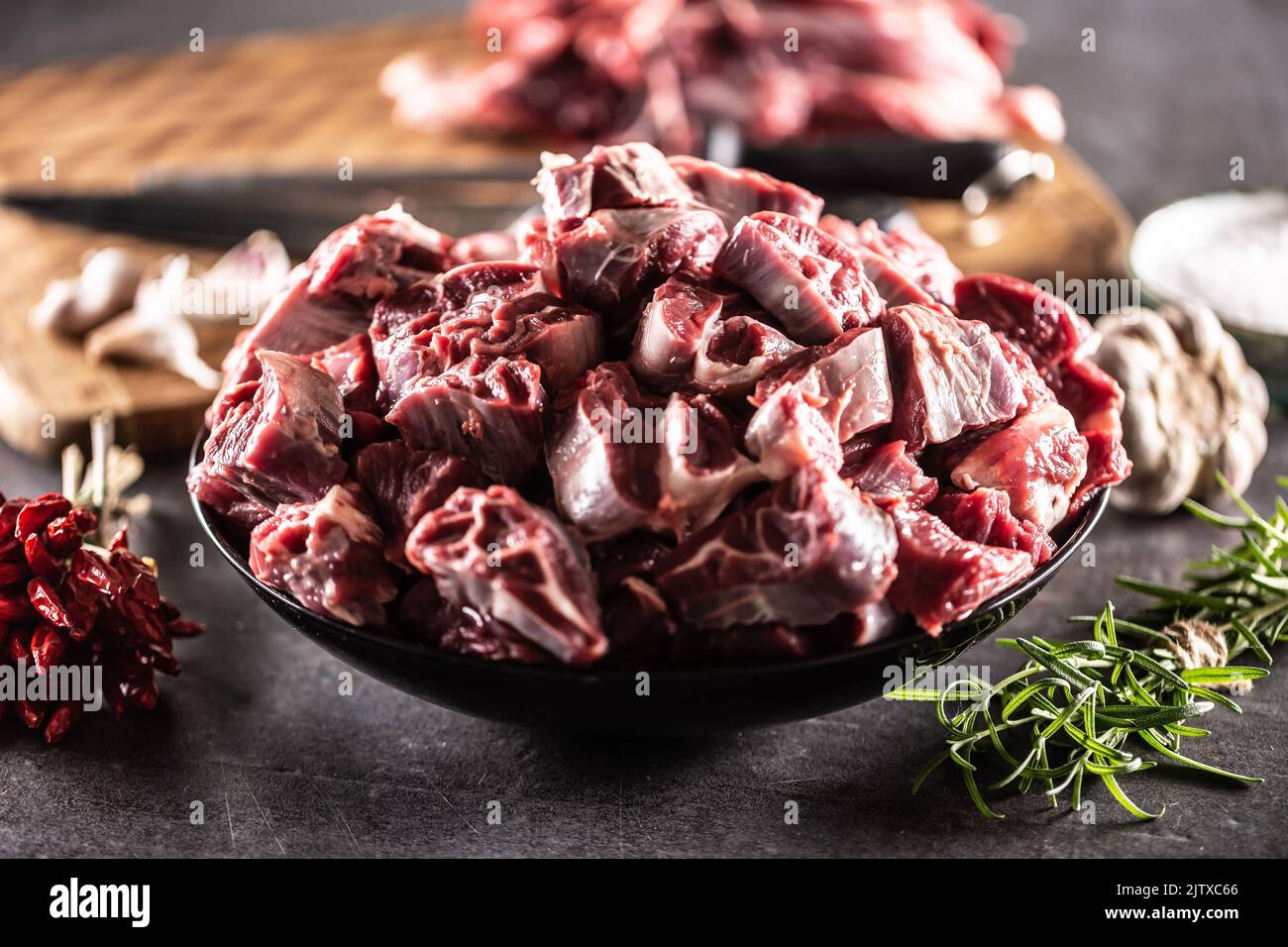 Fresh organic beef shank cuts in a bowl ready to be cooked with condiments. Stock Photo
