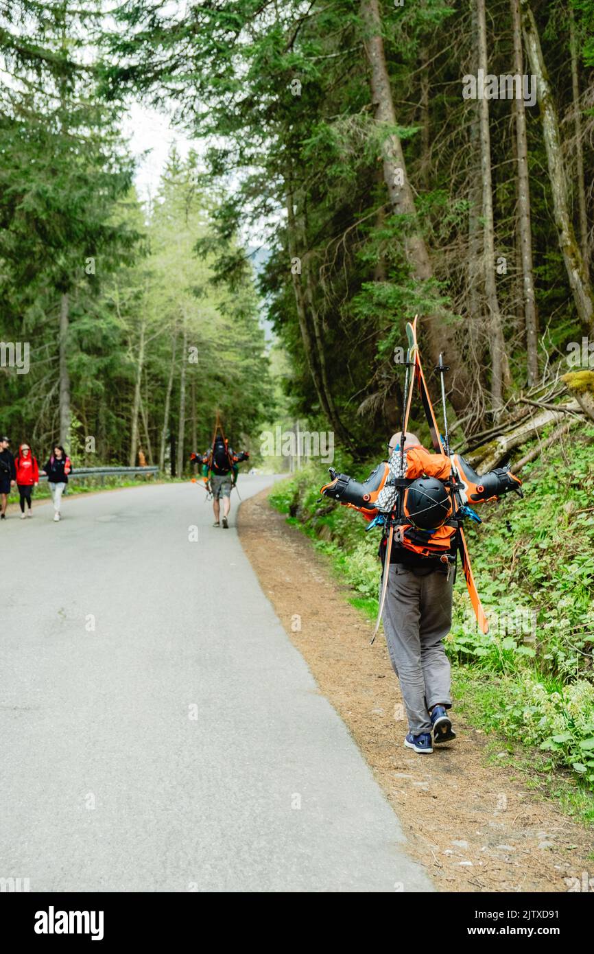 Tourists on the trail in the mountains Stock Photo