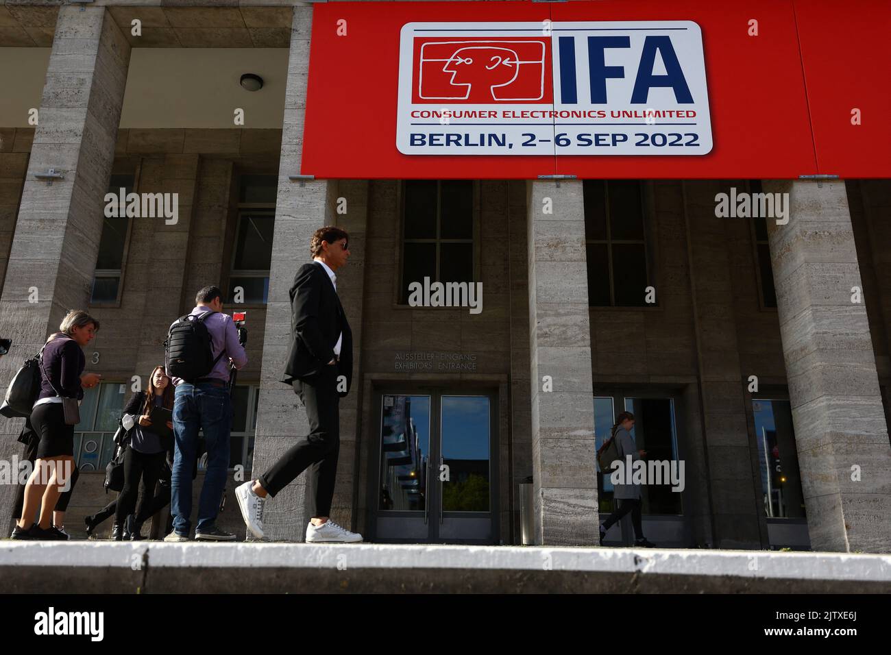 Visitors walk at the entrance to the international consumer technology fair IFA in Berlin, Germany September 2, 2022. REUTERS/Lisi Niesner Stock Photo