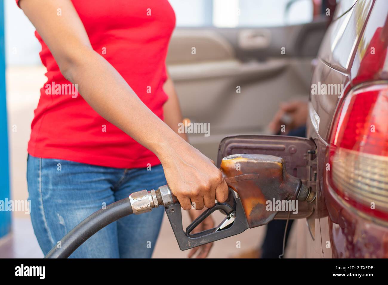 african fuel station attendant filling a car Stock Photo Alamy
