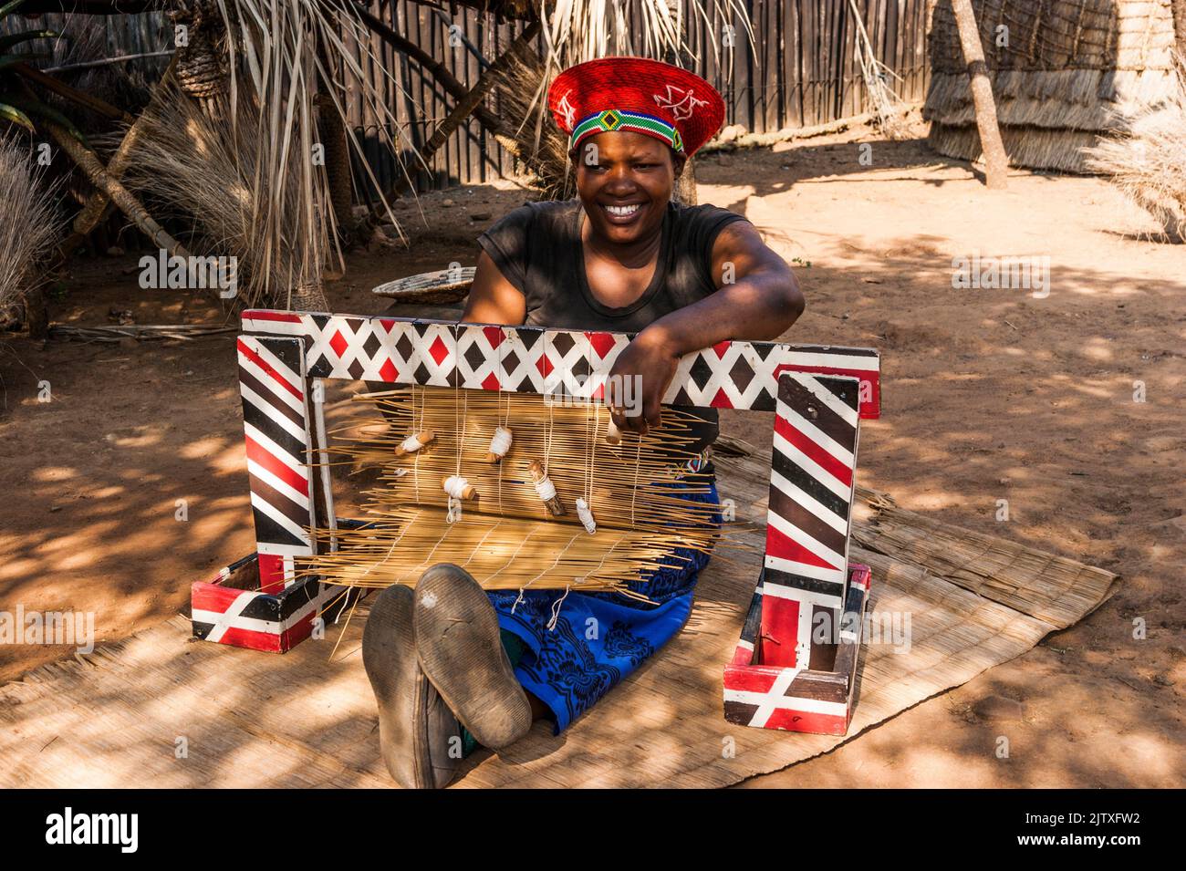 Zulu woman weaving a mat. Shakaland Zulu Village. KwaZuluNatal, South