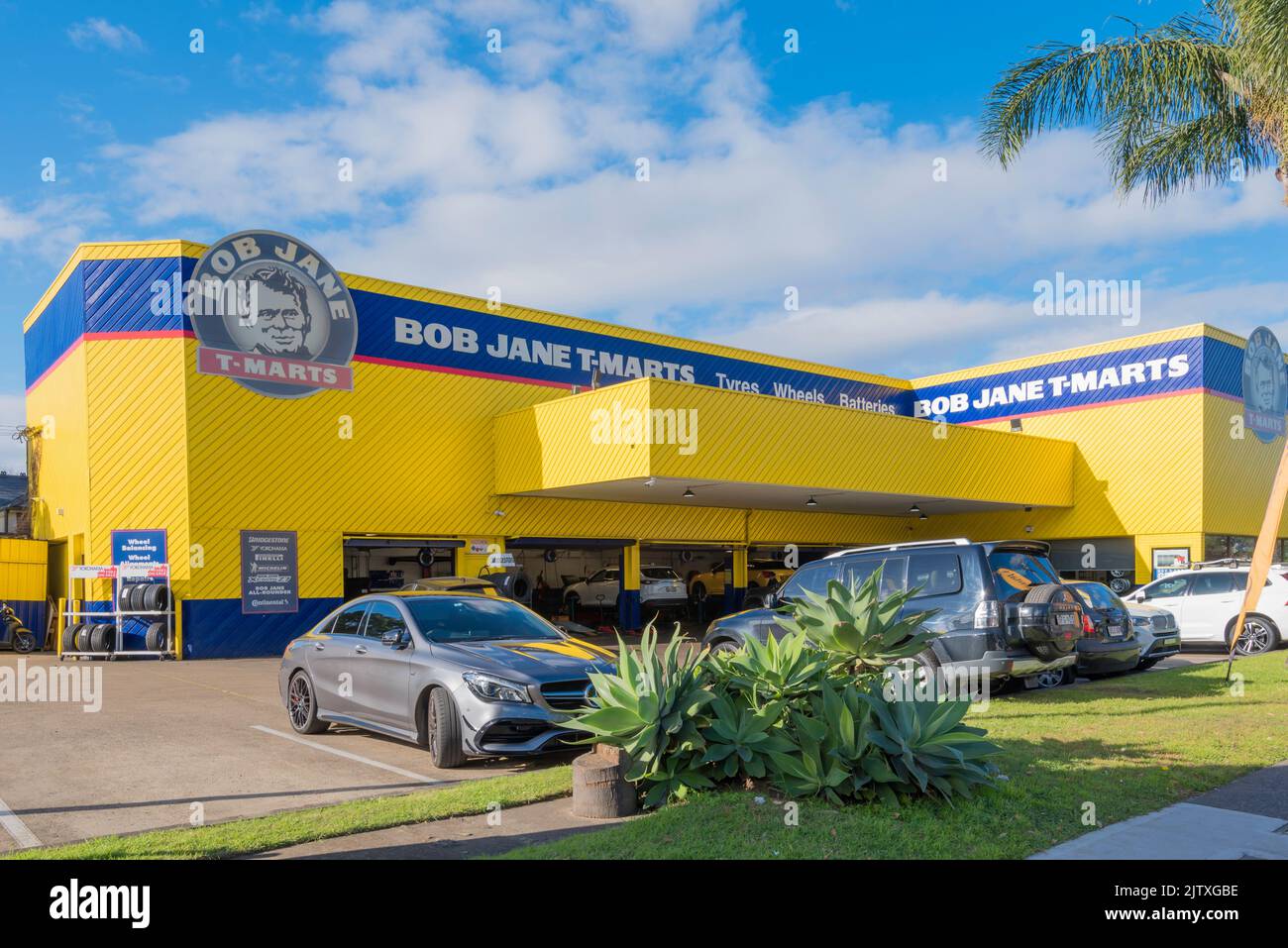 A Bob Jane (ex racing driver) T-Marts vehicle tyre (tire) wheels and automotive parts retail store at Summer Hill in inner-west Sydney, Australia Stock Photo