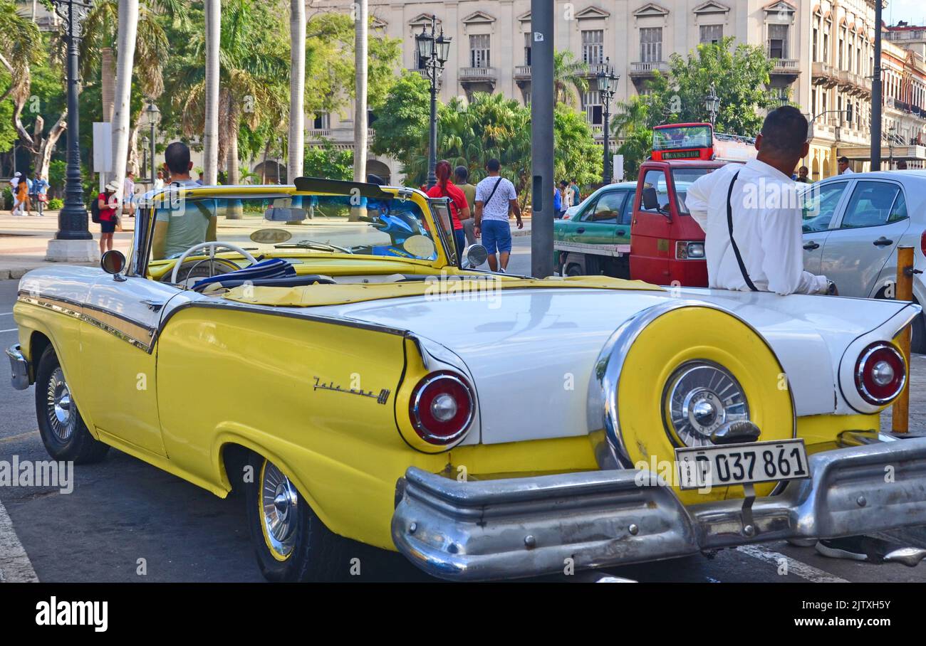 Old Yellow Taxi in Havana waiting for tourists Stock Photo