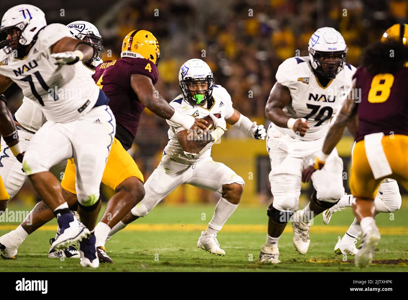 Northern Arizona running back Kevin Daniels (22) runs for a first down in the first quarter of an NCAA college football game against Arizona State in Stock Photo