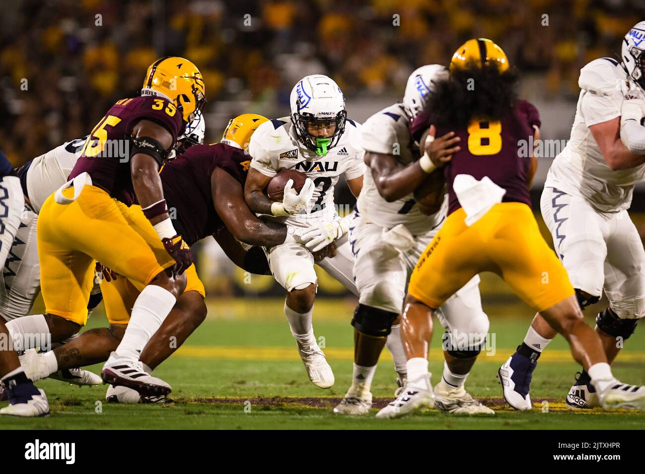 Northern Arizona running back Kevin Daniels (22) runs for a first down in the first quarter of an NCAA college football game against Arizona State in Stock Photo