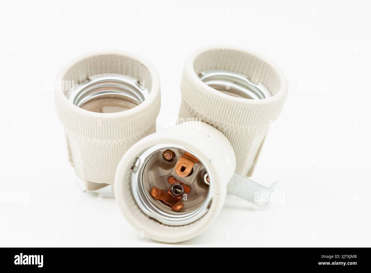 Electric ceramic socket model E27, for lighting. Selective focus with shallow depth of field. Stock Photo