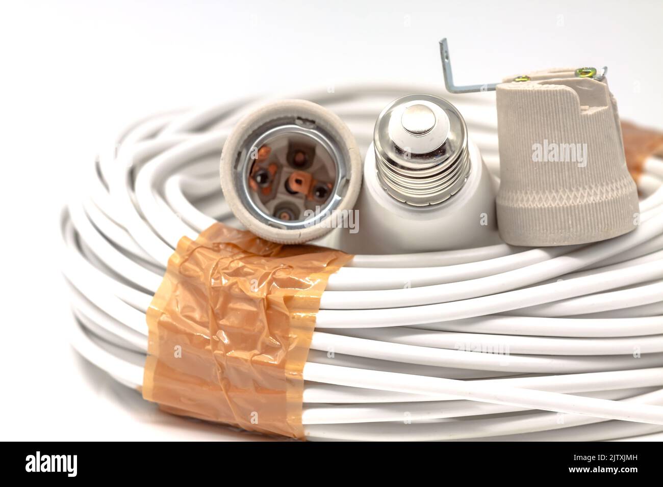 Electric ceramic socket model E27, for lighting. Selective focus with shallow depth of field. Stock Photo