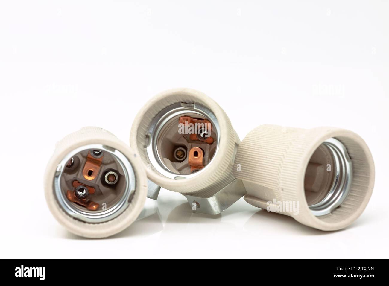 Electric ceramic socket model E27, for lighting. Selective focus with shallow depth of field. Stock Photo