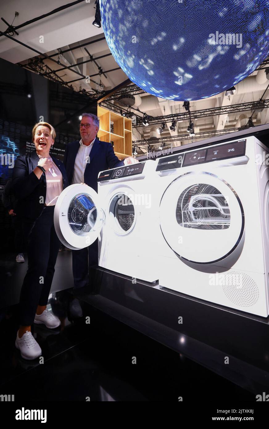 Berlin's Mayor Franziska Giffey reacts next to a washing machine from Bosch as she tours the international consumer technology fair IFA in Berlin, Germany September 2, 2022. REUTERS/Lisi Niesner Stock Photo