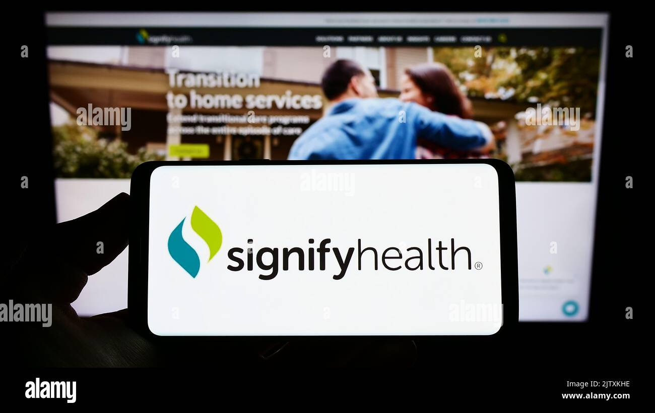 Person Holding Smartphone With Logo Of US Healthcare Company Signify ...