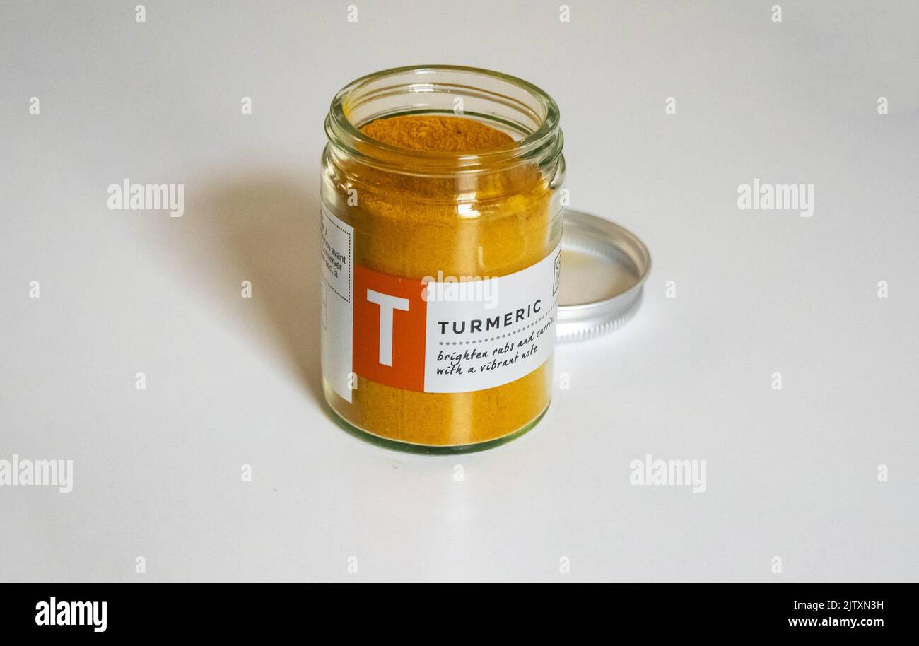 A jar of powdered turmeric, a healthy Indian spice Stock Photo