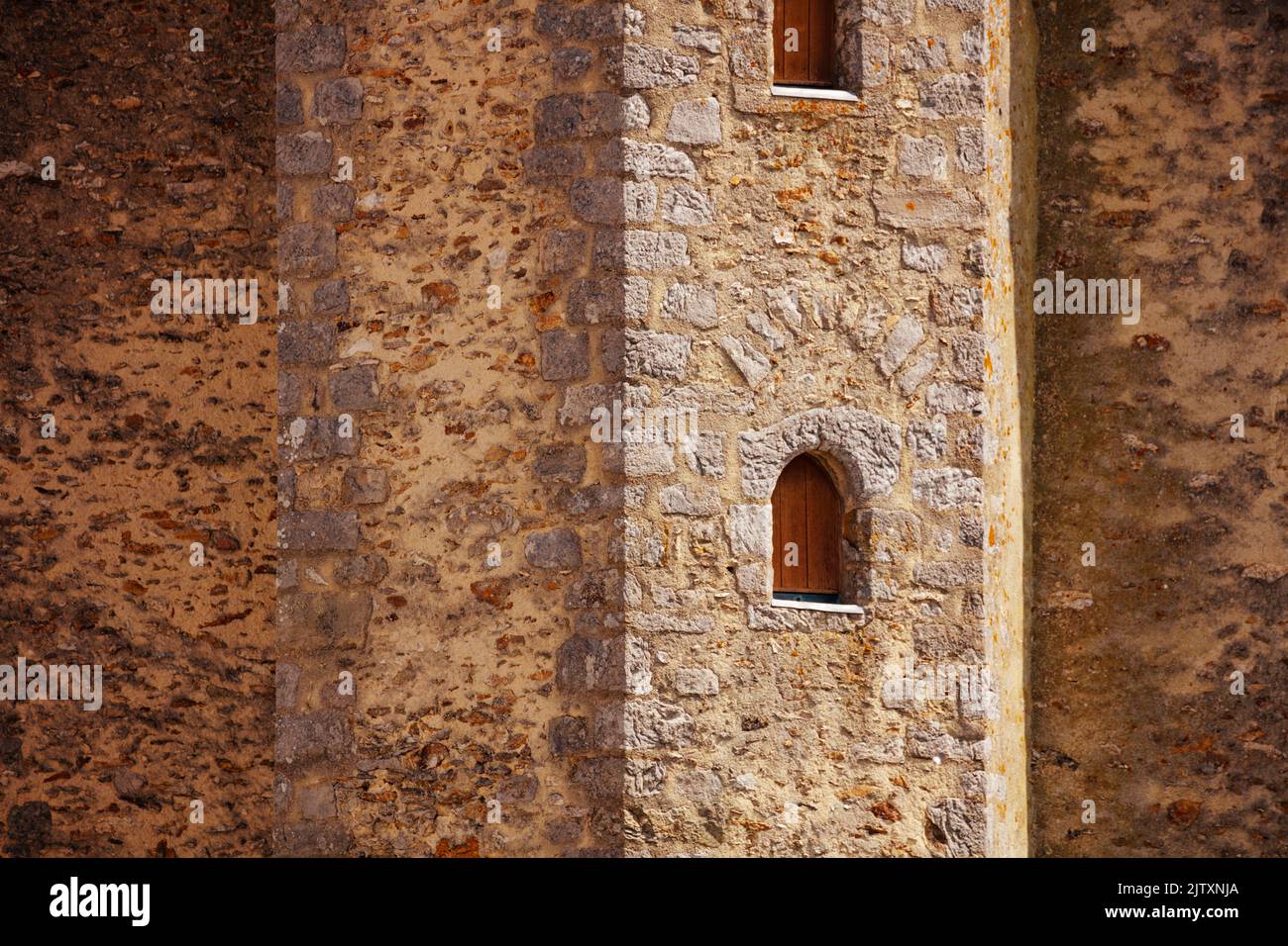 Close-up of loophole window in medieval stronghold castle tower Stock Photo