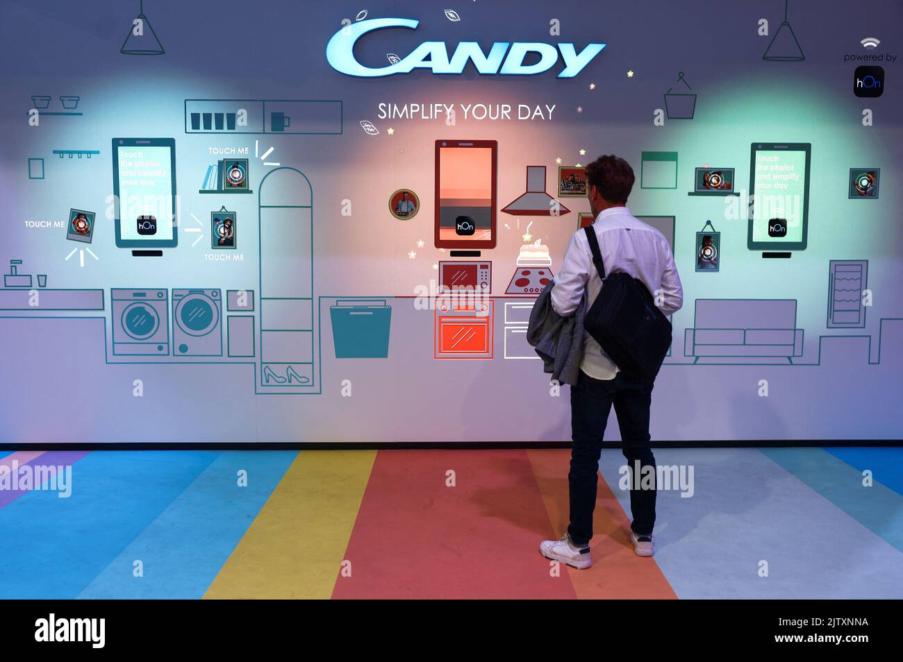 A visitor looks at the display from Candy at the international consumer technology fair IFA in Berlin, Germany September 2, 2022. REUTERS/Lisi Niesner Stock Photo