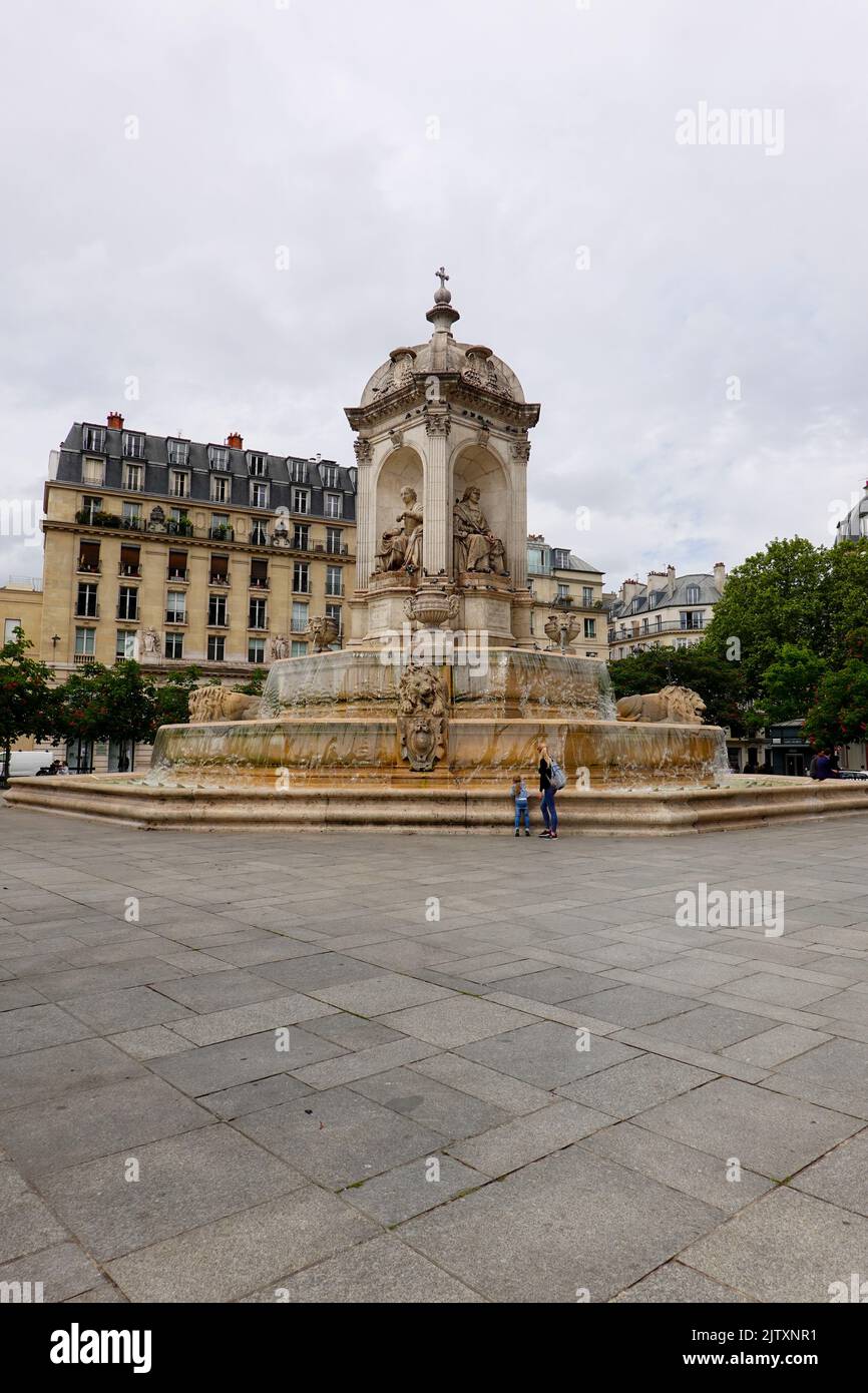 Woman and child looking at the Saint Sulpice Fountains, Paris, France. Stock Photo