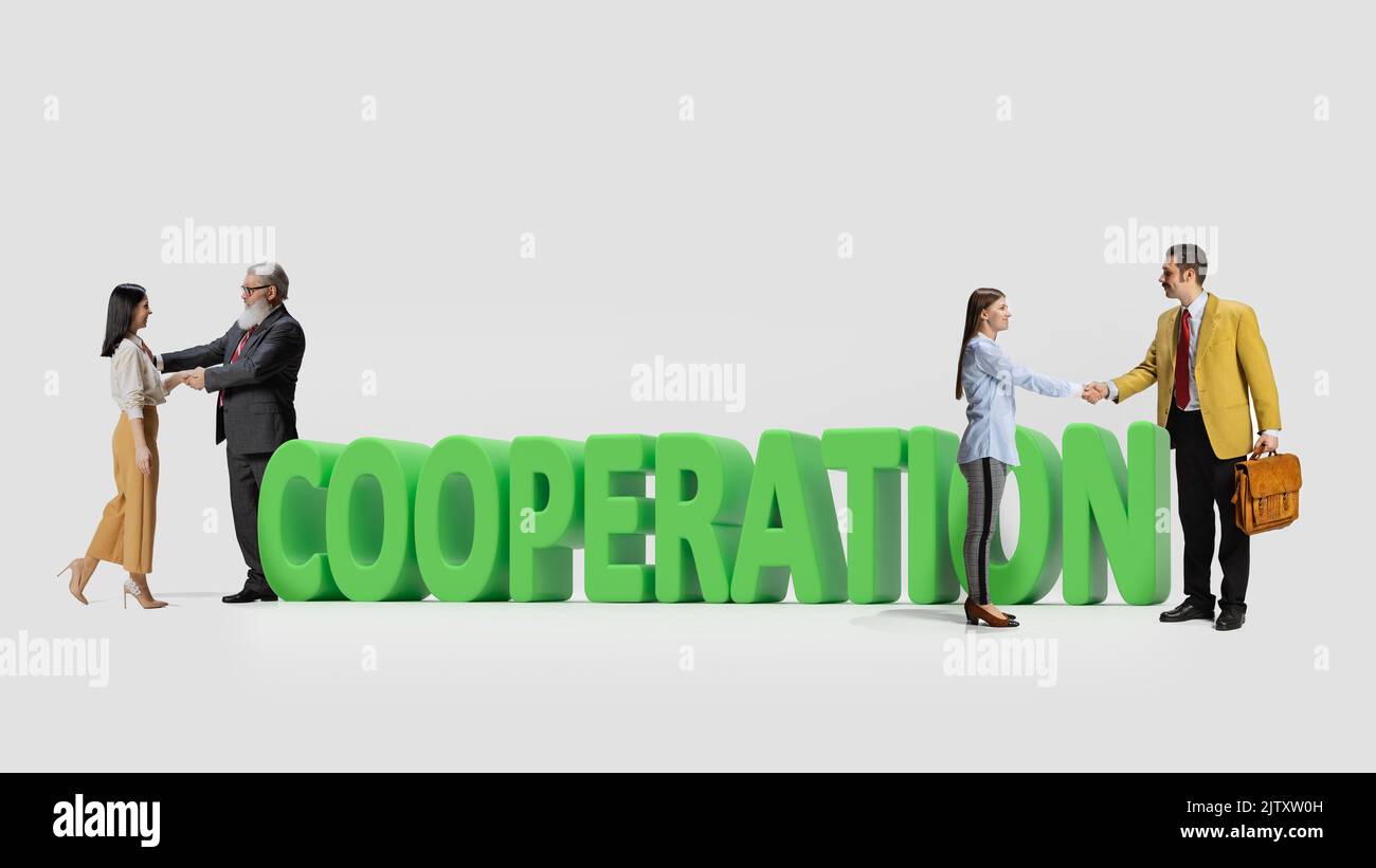 Successfully Dealt Business people, man and woman, shaking hands due to successful deal ...