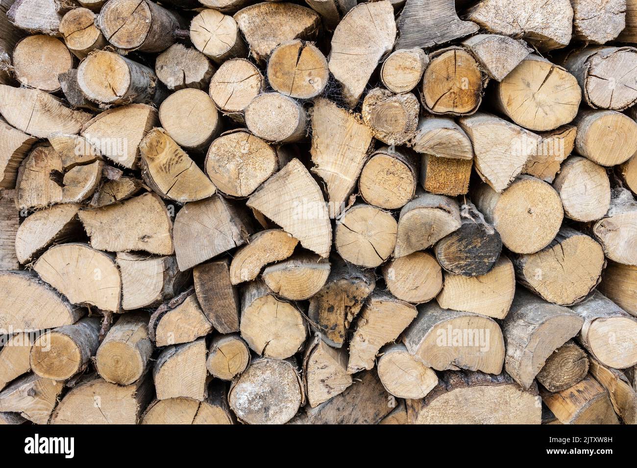 close up of logs stored to dry for use in a log burner Stock Photo