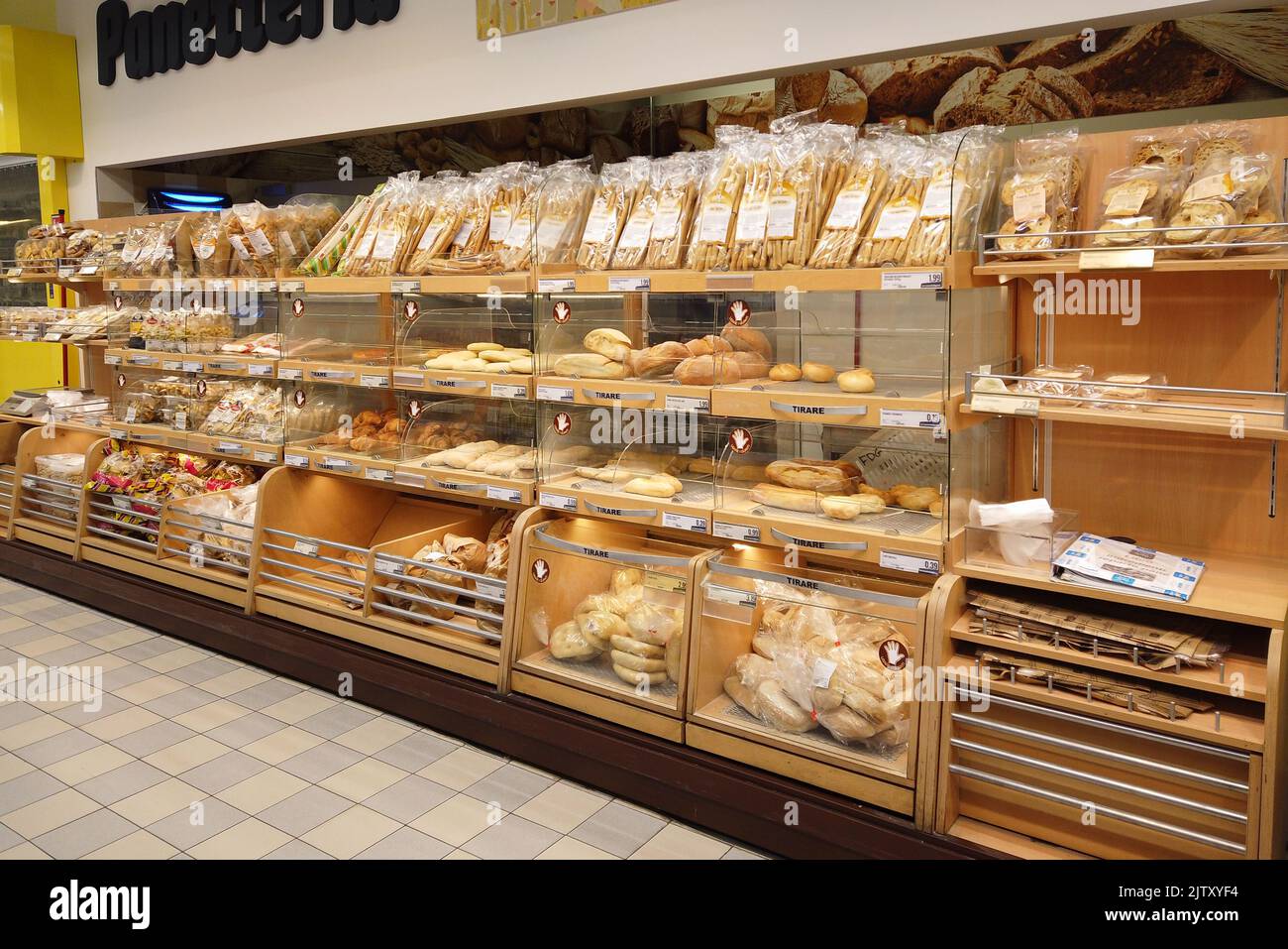 Fossano, Italy - August 30, 2022: shelf with different types of bread in the bakery department of the Italian supermarket Eurospin Stock Photo