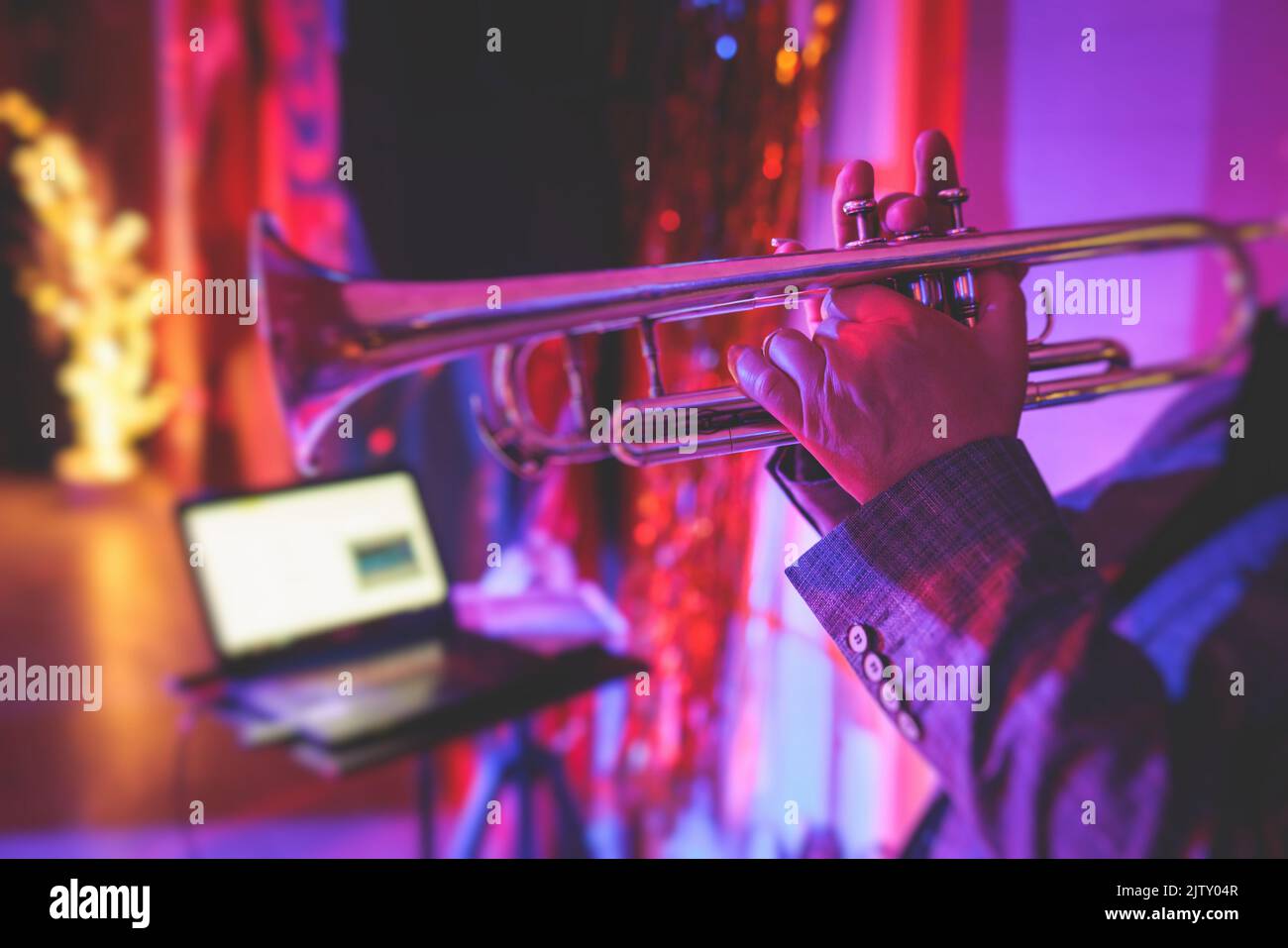 Concert view of a male trumpeter, professional trumpet player vocalist