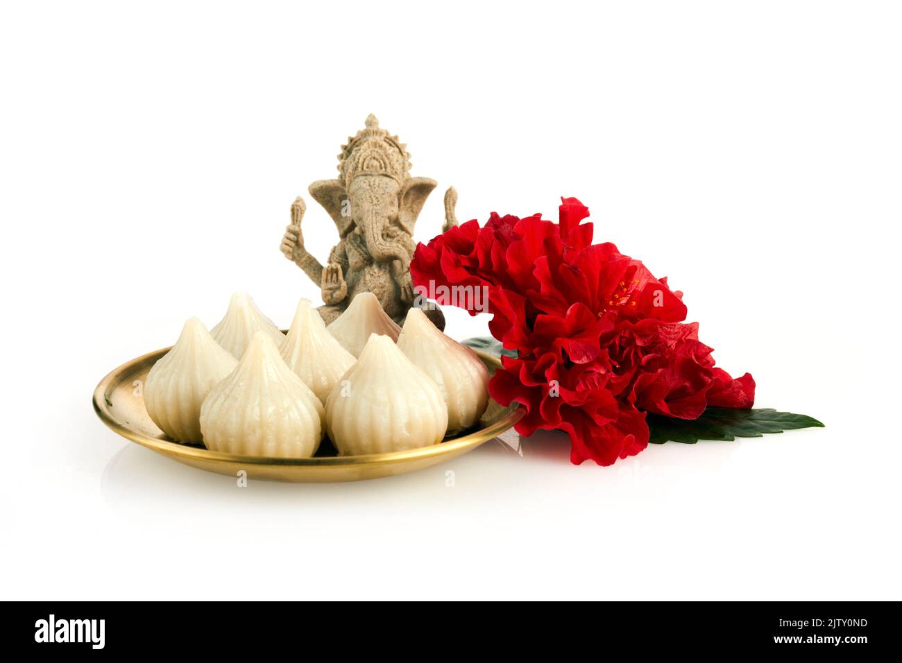 Idol of lord Ganesha with Modak Sweet Dish and flower. Ganesh chaturthi