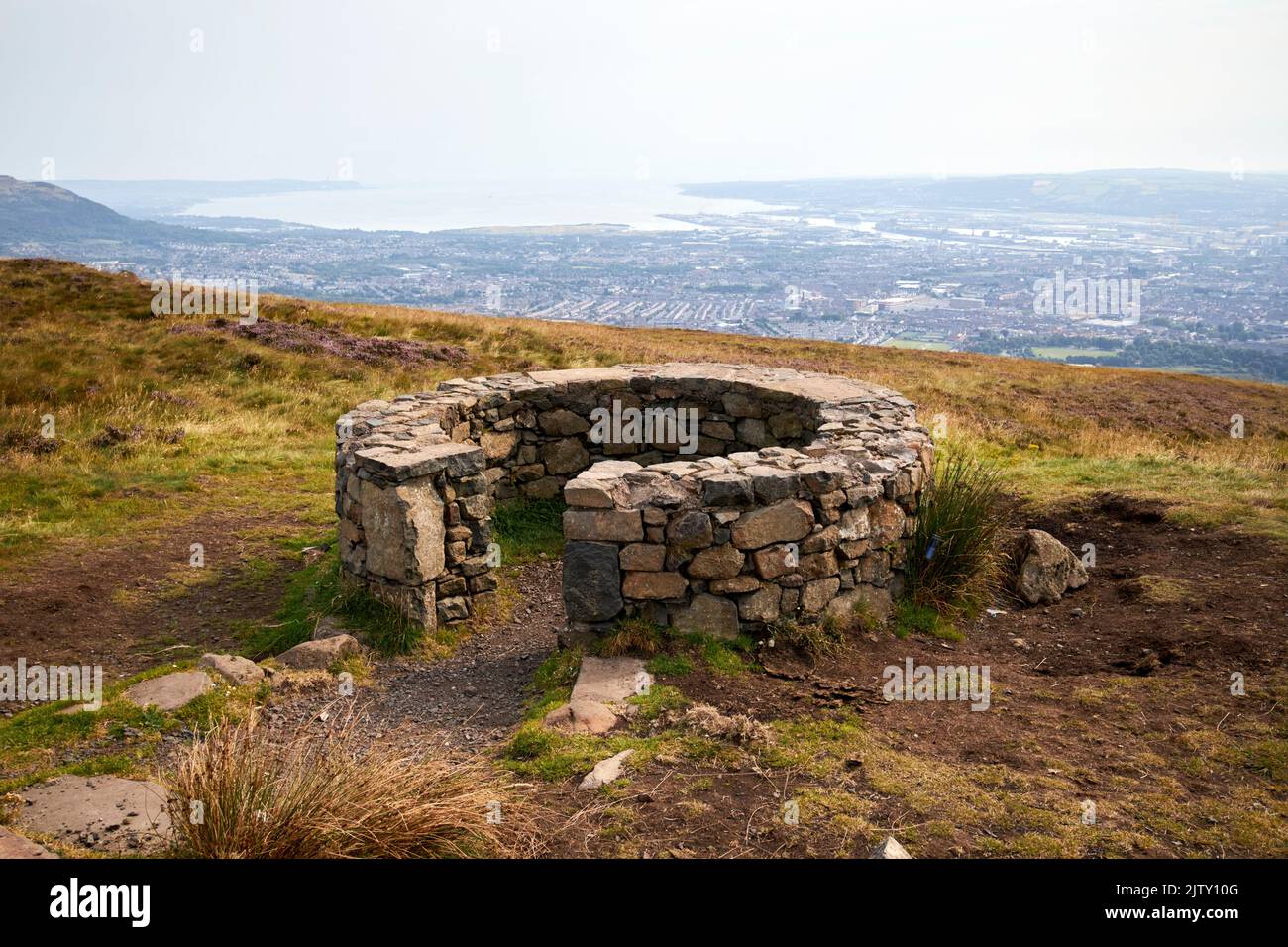local stone basalt viewpoint at the summit of Black mountain in divis and black mountain belfast hills range overlooking belfast northern ireland Stock Photo