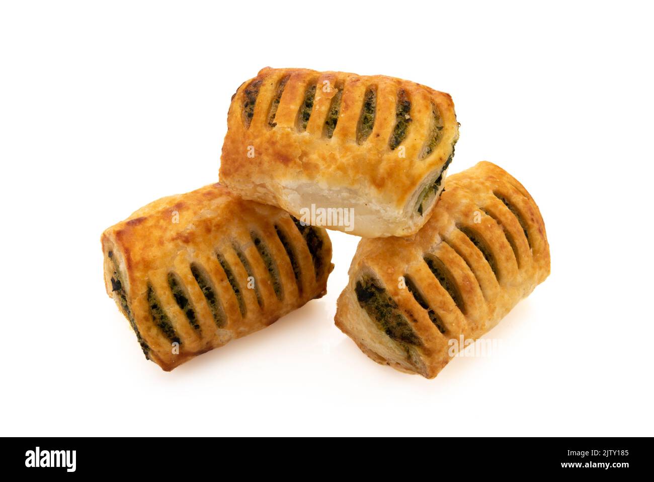 Baked puff pastry stuffed with spinach and cheese isolated on white Stock Photo