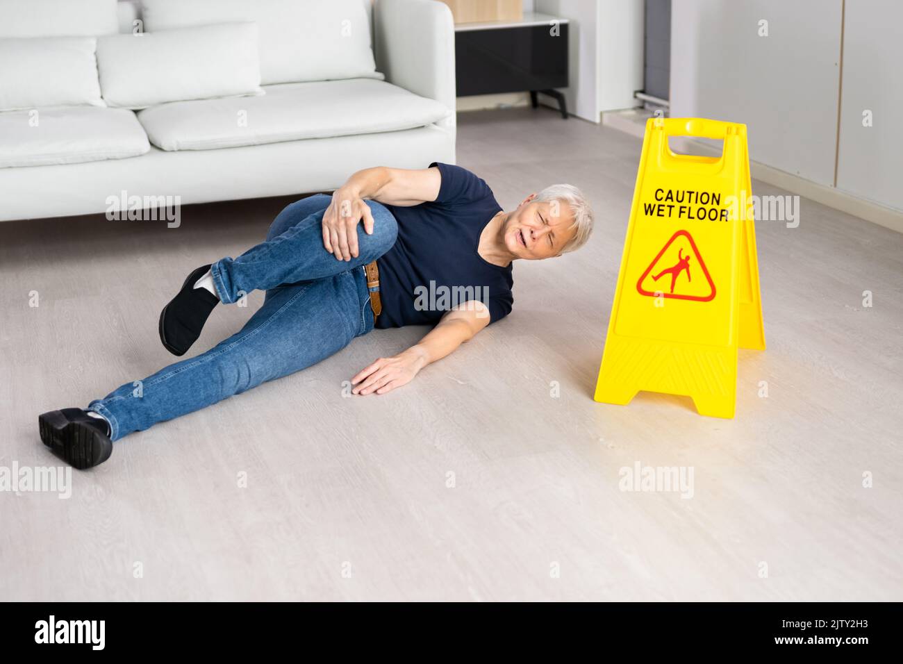 Slip Fall Accident. Floor Sign Caution And Safety Stock Photo
