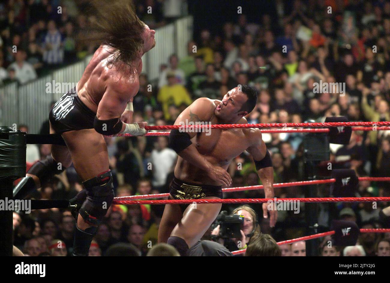 Pic shows; WWF now WWE wrestling in 2000 One of the biggest stars The Rock  - beats Triple H in a bout at Earl’s Court in the first ever British tourn Stock Photo