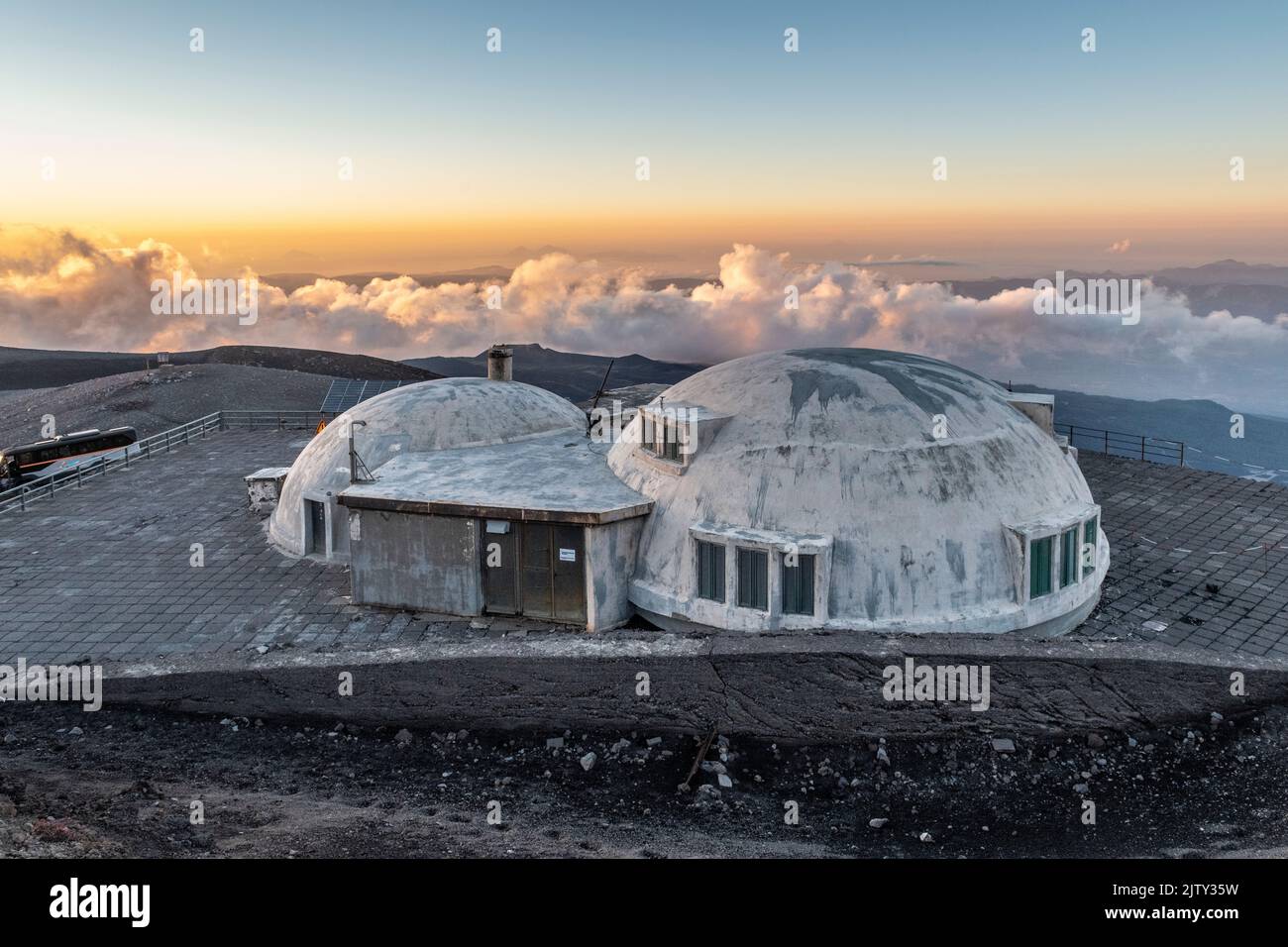 The volcanological observatory of Pizzi Deneri at 2800m on Mount Etna, Sicily, Italy, seen at sunset Stock Photo