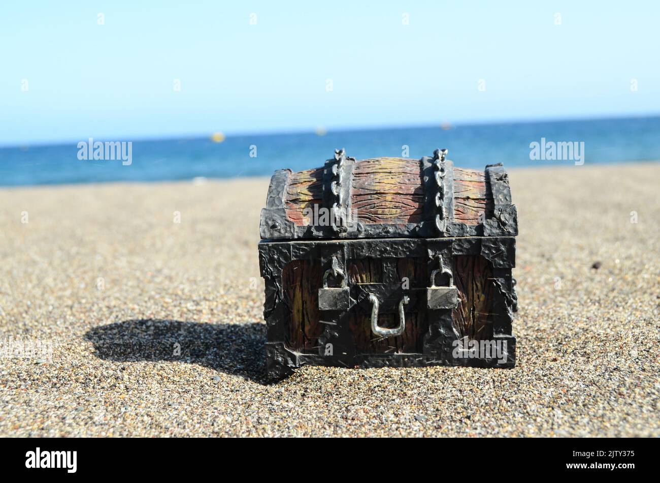 An old wooden and iron treasure chest on the beach Stock Photo - Alamy