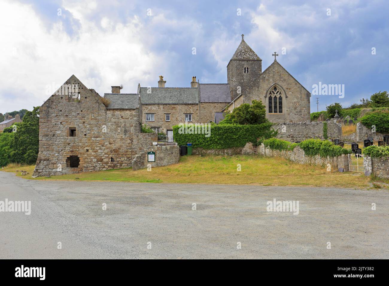 Penmon Priory on the Wales Cost Path, Penmon near Beaumaris, Isle of Anglesey, Ynys Mon, North Wales, UK. Stock Photo