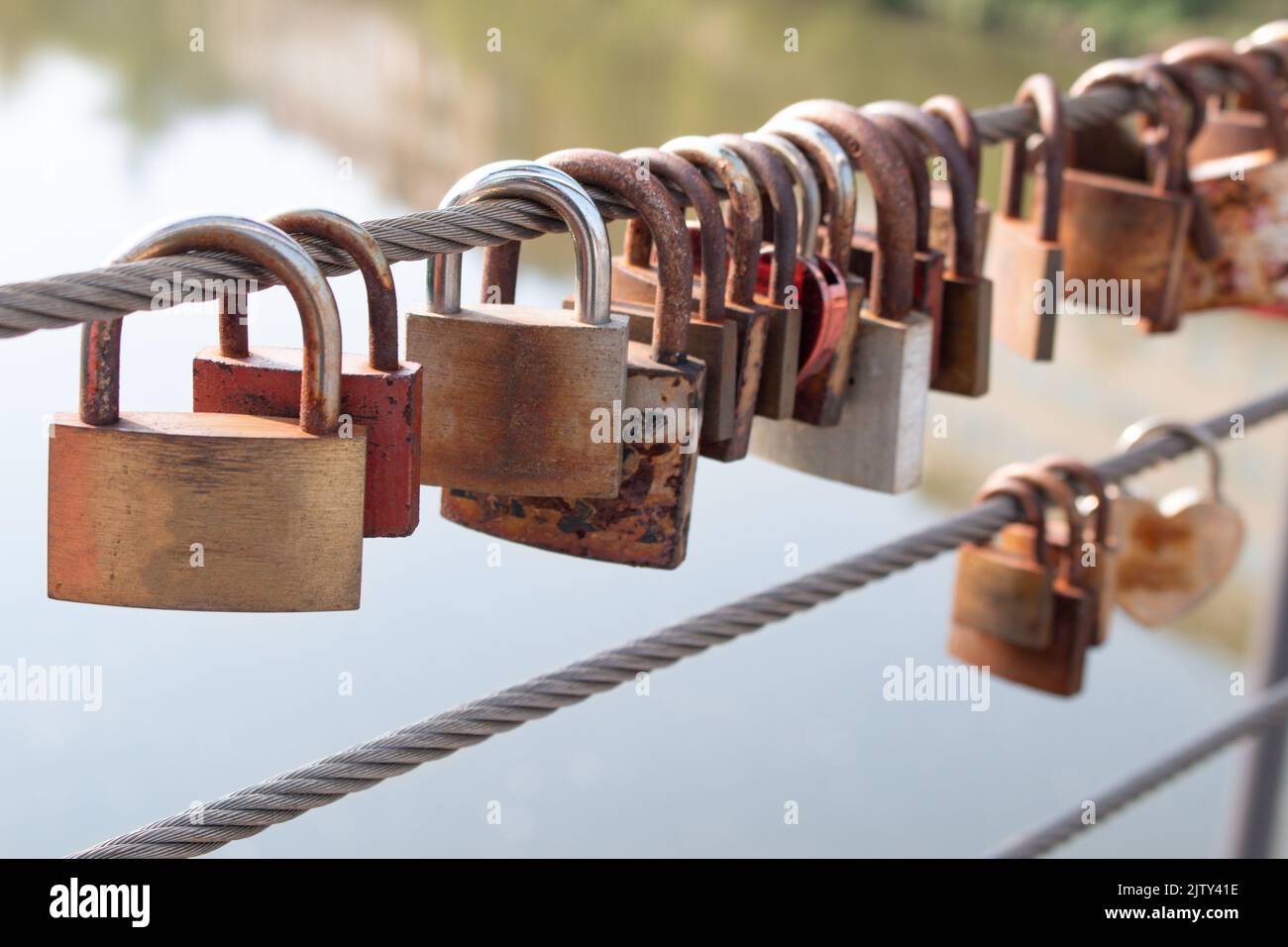 Padlocks symbolizing love on a bridge Stock Photo