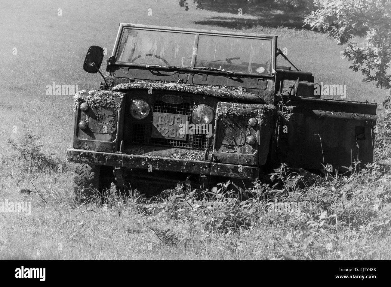 Abandoned disused land rover in black and white Stock Photo