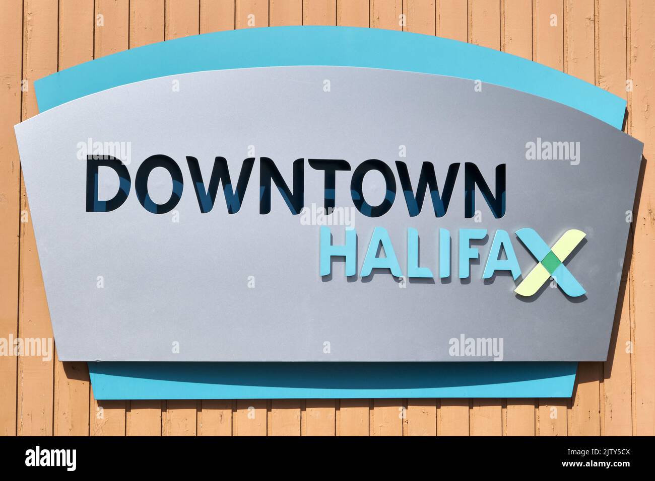 Sign on a wall on the waterfront near the ferry terminal in Downtown Halifax.  Halifax is the capital and largest city in the Province of Nova Scotia. Stock Photo