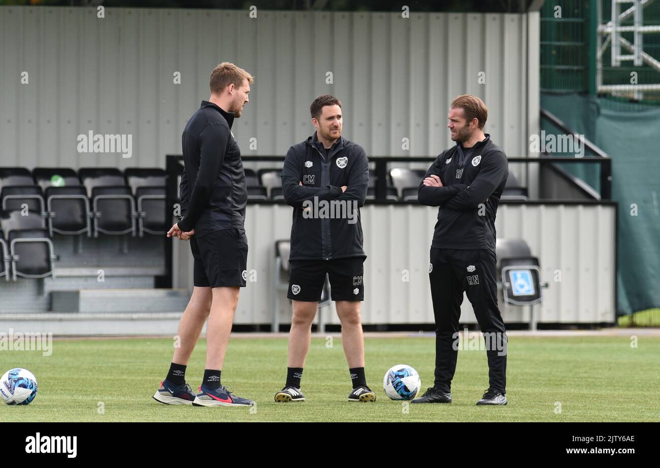 Oriam Sports Centre Edinburgh.Scotland UK.2nd.Sept 22 Hearts Manager Robbie Neilson (R) chats with backroom staff during training session for Cinch Premiership match vs Livingston Credit: eric mccowat/Alamy Live News Stock Photo